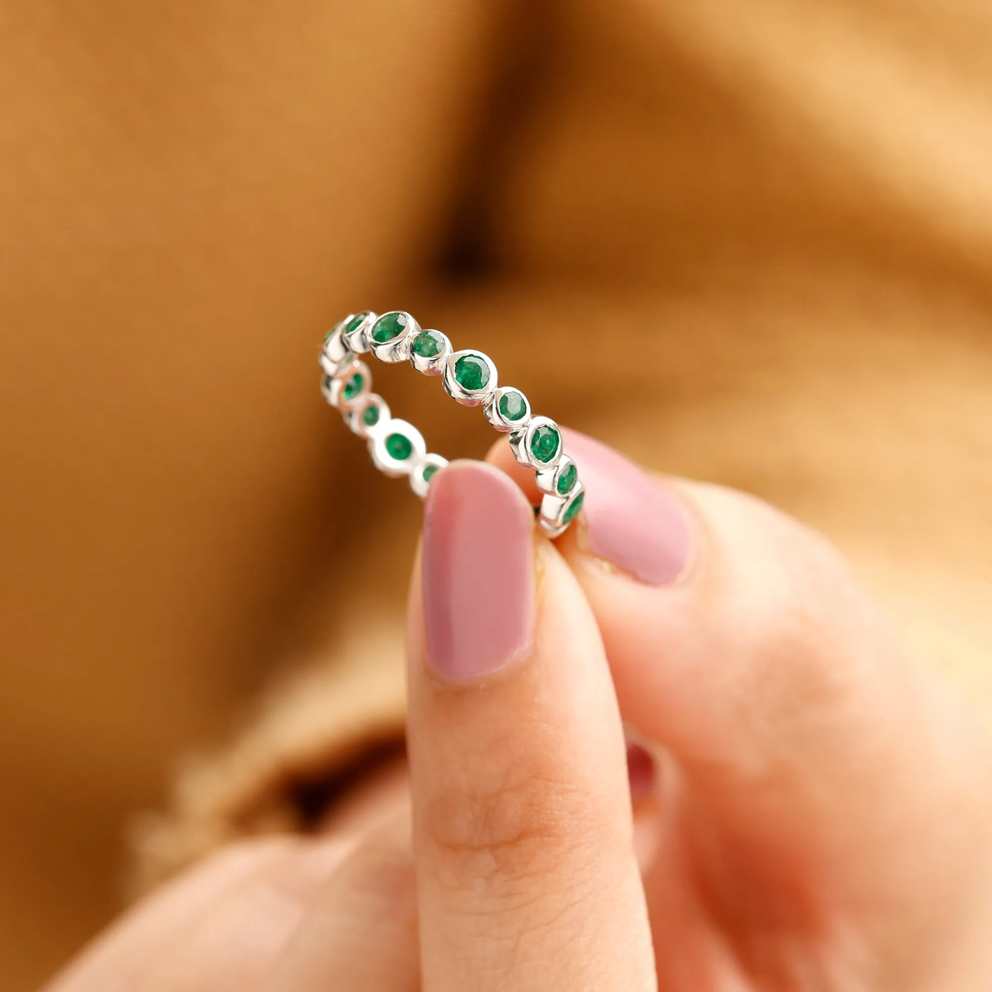 1 CT Emerald Uneven Eternity Ring in Bezel Setting