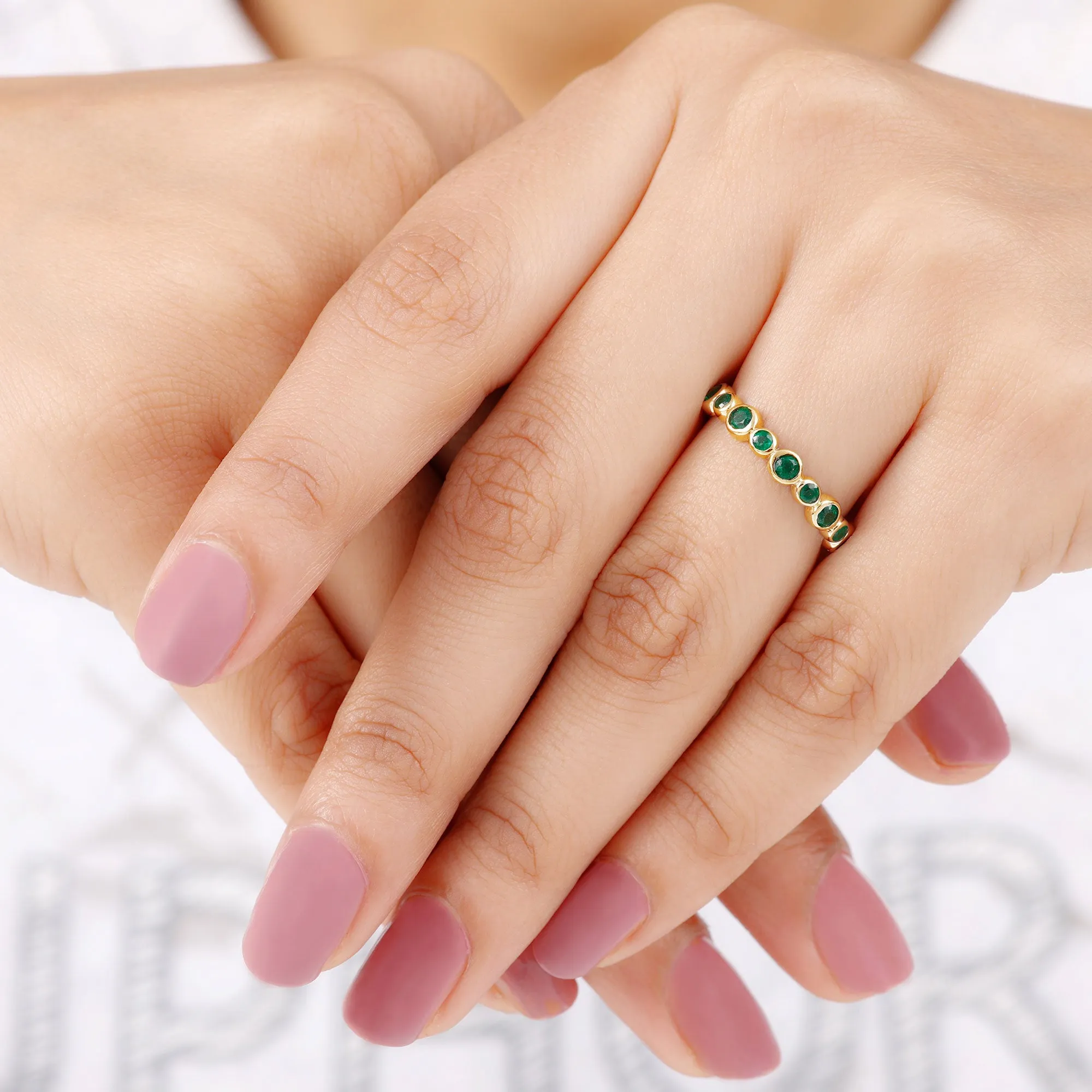 1 CT Emerald Uneven Eternity Ring in Bezel Setting
