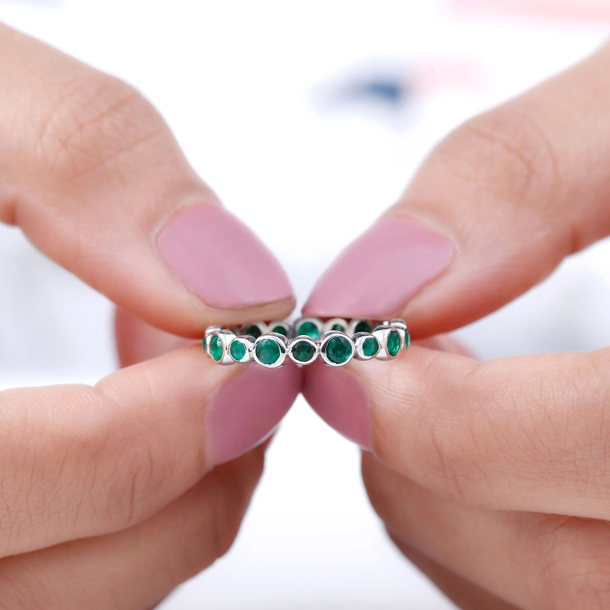 1 CT Emerald Uneven Eternity Ring in Bezel Setting